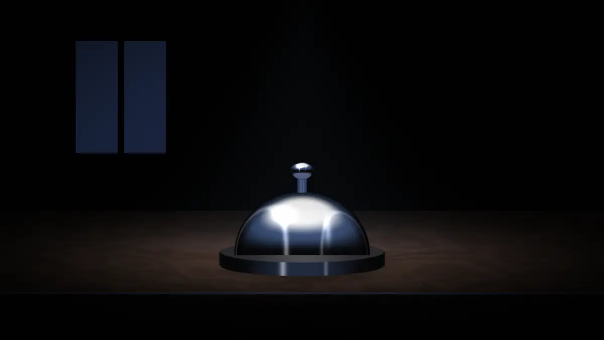 The bell on the desk at night, moonlit window behind